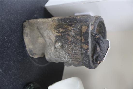 A medieval or later limestone head, height 14in.